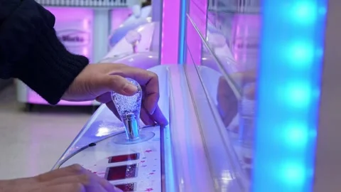 Playing a toy crawler crane machine joystick. Stock Footage 306315366