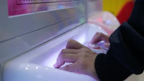 Playing a toy crawler crane machine joystick. Stock Footage 306315439