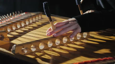Playing traditional musical instruments. Close-up of hummered dulcimer. Stock Footage 146455293