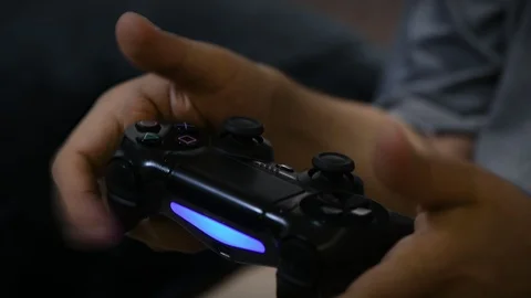 Playing video game on a console controller joystick Stock Footage 108248399