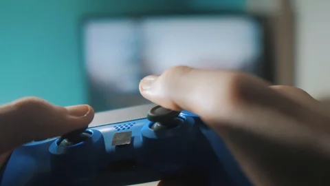 Playing video game console on tv. Hand hold new joystick online video console on 스톡 동영상 100342565