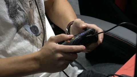 Playing video game with joystick Video stock 81002053