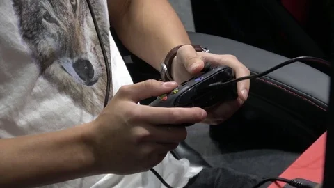 Playing video game with joystick Stock Footage 81011440