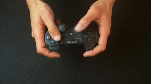 Playing video games with controller Stock Footage 92523483