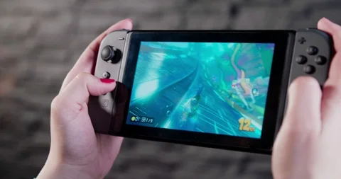 Playing video games on portable console Stock Footage 111006895