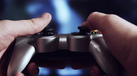 Playing videogame with a gamepad Stock Footage 48719795