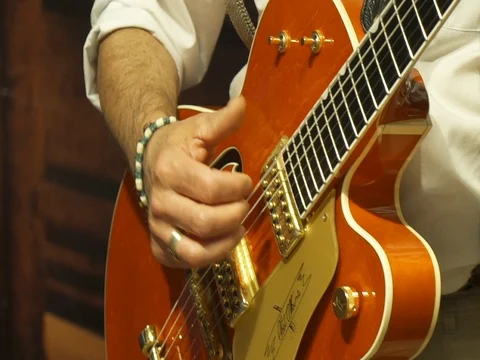 Playing a vintage guitar Stock Footage 80631248