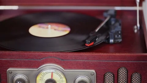 Playing a vinyl player, a retro record player, a man turns on a vinyl player Stock-Footage 94920156