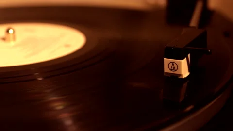 Playing vinyl records in low light conditions. Listen to music. Stock Footage 237152643