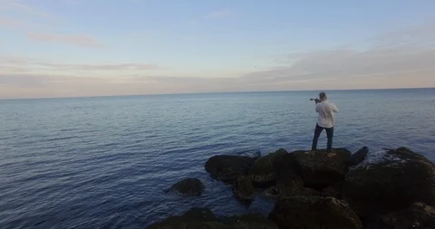 Playing a violin, on the background of the sea Stock Footage 127797242