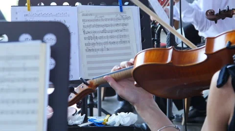 Playing the violin in the orchestra Stock Footage 64726798