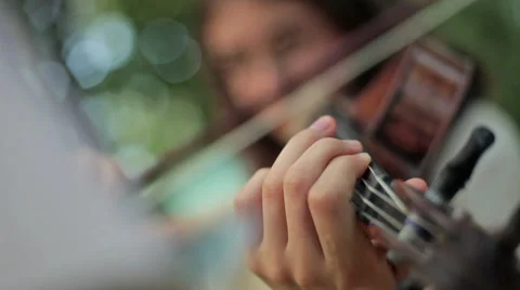 Playing violin outdoors, close up Stock Footage 45328694