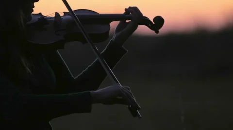 Playing Violin at Sunset 動画素材 44340615