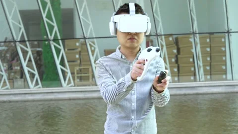 Playing virtual reality interactive game with VR gun Bluetooth handle Stock Footage 154449195