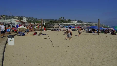 Playing Volleyball on the Beach Stock Footage 91719273