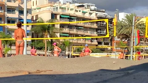 Playing volleyball on the beach Stock Footage 188592729