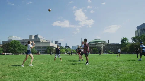 Playing volleyball at Front Campus, in Toronto Stock Footage 217648258