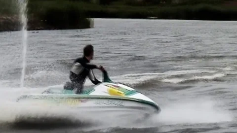  Playing with waterscooter Stock Footage 85270981