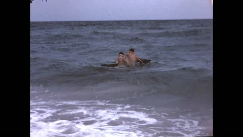 Playing in the Waves 1963 Stock Footage 220087150