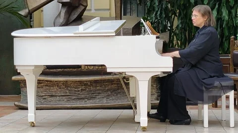 Playing the white piano Stock Footage 157722667