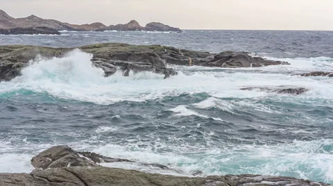 Playing with the wind waves on the beach in Norway Video stock 49232302