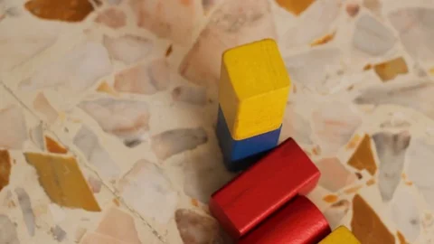 Playing with wooden colored blocks Stock Footage 74801708