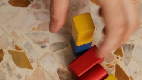 Playing with wooden colored blocks Stock Footage 74801730