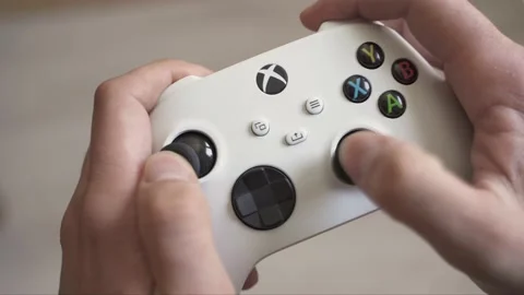 Playing with the Xbox Series S controller Stock Footage 154587150
