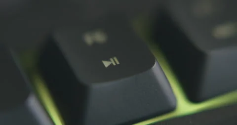 "Play/Pause" key being used - 60FPS RGB Keyboard Video stock 145855713