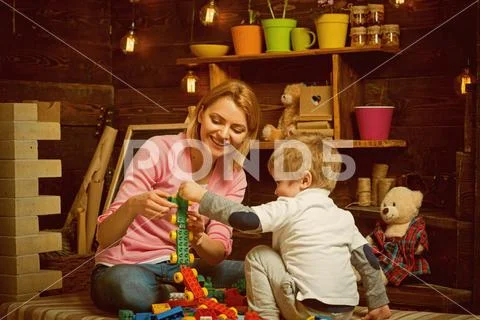 Playroom concept. Playroom is where imagination go wild. Mother and child play Stock Photos
