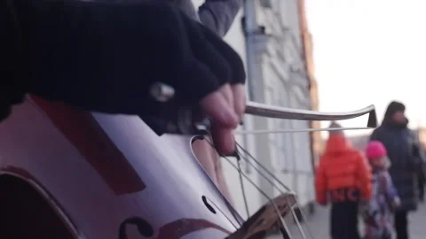 Plays On Cello outdoors Stock Footage 238754139