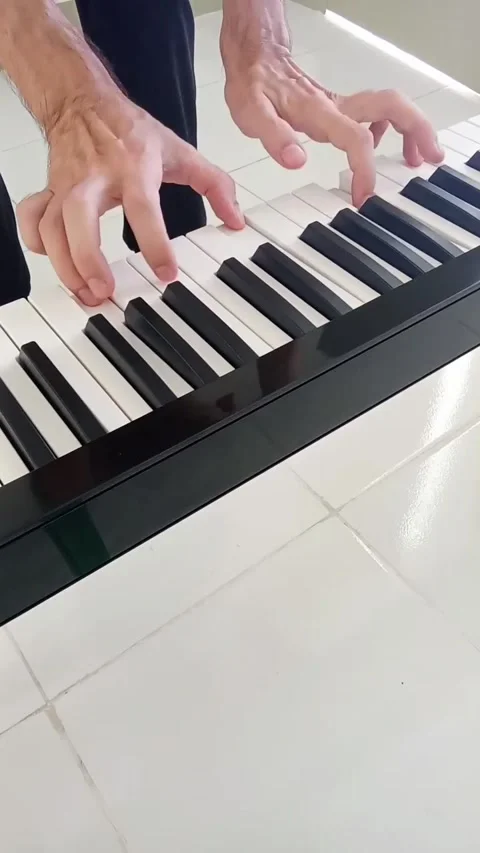 Plays a digital piano Stock Footage 322001811