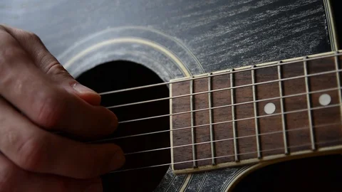 Plays the guitar closeup Stock Footage 92908778