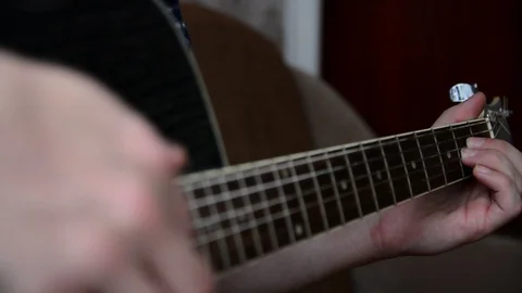 Plays the guitar closeup Stock Footage 92908880