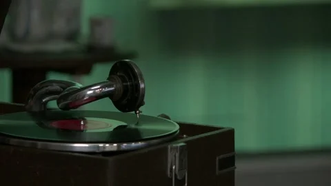 Plays an old gramophone Stock Footage 308634509