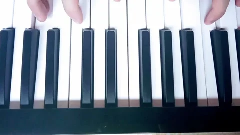 Plays the piano Stock Footage 321815635