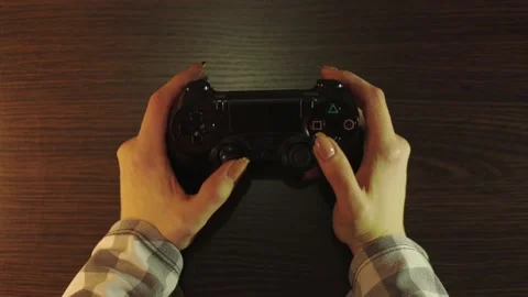 Plays with a wireless controller Stock Footage 167788736