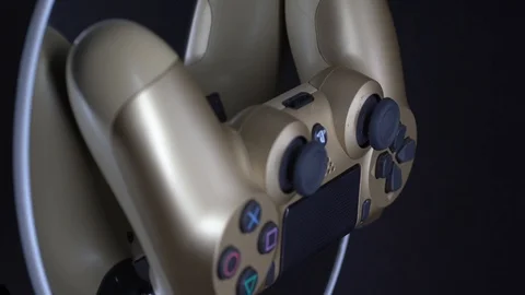 Playstation 4 Dual Shock Controller, Gold Colour Video stock 106113720