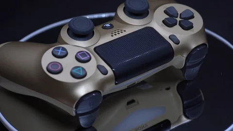 Playstation 4 Dual Shock Controller, Gold Colour Stock Footage 106114321