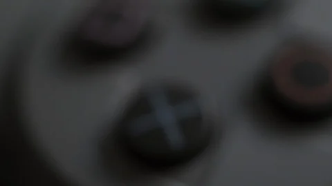 Playstation X Button Macro PS1 Classic extreme close up Stock Footage 119945687