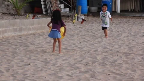 Playtime at the beach in Mexico Stock Footage 1126964