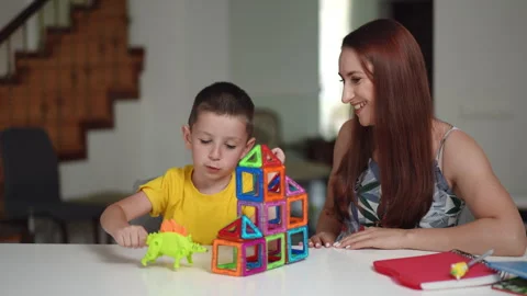 Playtime Experiences Shared Between Child and Adult Using Colorful Toys Stock Footage 305266514