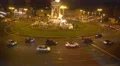 Plaza de Espana in Barcelona, top view at night, cars driving around fountain 4k or 4k+ Resolution