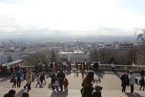 Plaza of people viewing sunny sky in Paris Stock Photos