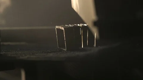 Plazma looking stream of yellow sparkles over a mashine tool in a workshop Video stock 105450177