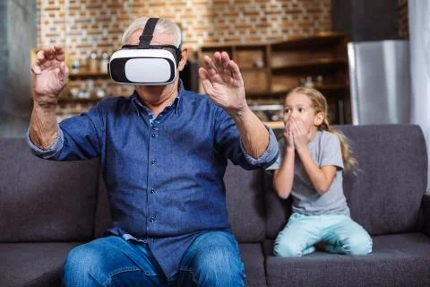 Pleasant aged man using vr device Stockfoto's