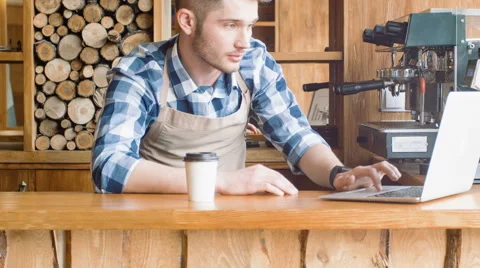 Pleasant barista standing at the counter Stock Footage 64301682