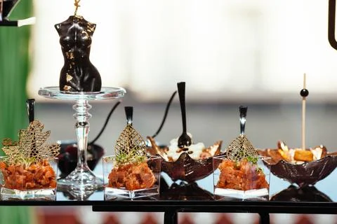 A pleasant evening with a delicious appetizer, a buffet table with appetize.. Stock Photos