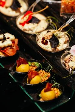 A pleasant evening with a delicious appetizer, a buffet table with appetize.. Stock Photos
