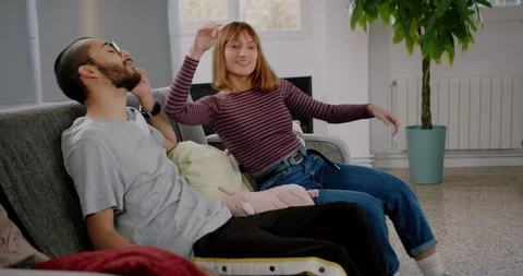 Pleasant Hispanic couple communicating after relocation in new home flat Stock Footage 123666495